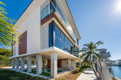 A striking new construction waterfront residence, offering a