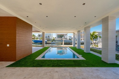 A striking new construction waterfront residence, offering a