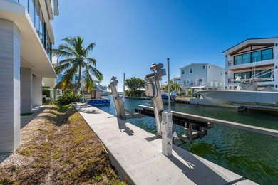 A striking new construction waterfront residence, offering a