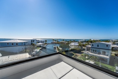 A striking new construction waterfront residence, offering a