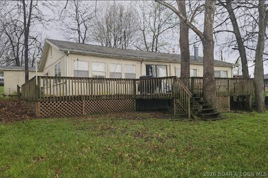 Lakefront investment opportunity! This 3-bedroom, 1-bath home - photo 1