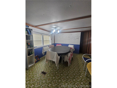 Lakefront investment opportunity! This 3-bedroom, 1-bath home - photo 6