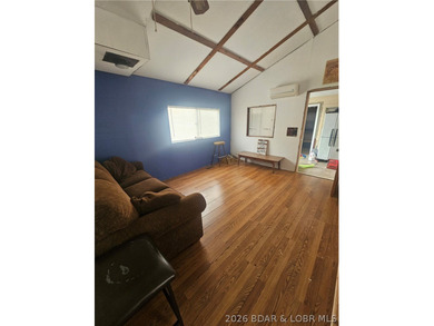 Lakefront investment opportunity! This 3-bedroom, 1-bath home - photo 8