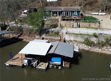 Lake of the Ozarks waterfront property featuring natural stone - photo 1