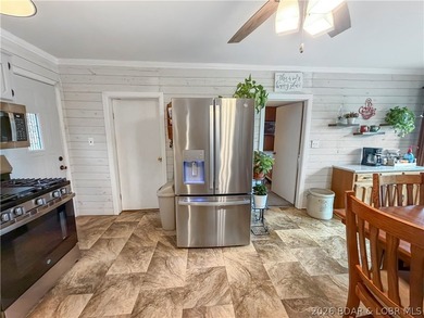 Lake of the Ozarks waterfront property featuring natural stone - photo 9