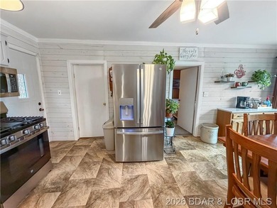 Lake of the Ozarks waterfront property featuring natural stone - photo 9