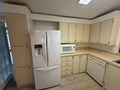 This well-cared for home is located on the 9th hole on the West - photo 8