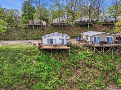 Wake up to beautiful lake sunrises at this turnkey retreat on - photo 2