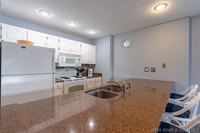 Imagine waking up to miles of sparkling lake views stretching - photo 6