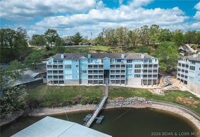Enjoy stunning lake views from your screened-in deck overlooking - photo 2