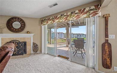 Enjoy stunning lake views from your screened-in deck overlooking - photo 6