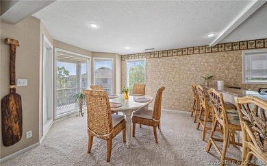 Enjoy stunning lake views from your screened-in deck overlooking - photo 7