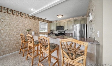 Enjoy stunning lake views from your screened-in deck overlooking - photo 9