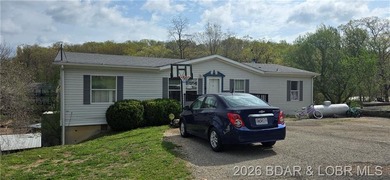 Large lakefront family home tucked back in a protective cove for - photo 1