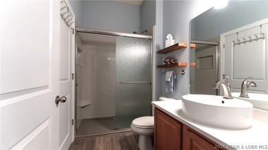 Experience refined lakefront living in this fully updated - photo 18