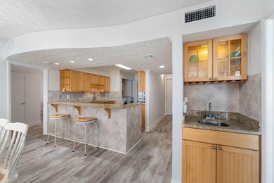 Experience elevated coastal living from this penthouse-level - photo 11
