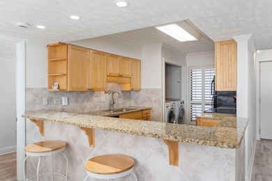 Experience elevated coastal living from this penthouse-level - photo 12
