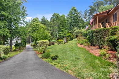 Nestled within the exclusive gated Lake Rhodhiss community of - photo 3