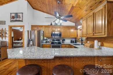 Nestled within the exclusive gated Lake Rhodhiss community of - photo 9