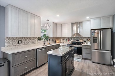 Beautifully updated and move-in ready, this 4-bedroom, 3-bath - photo 4