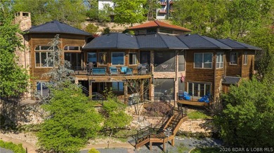 Lodge-style lakefront retreat sitting on over 1 acre with an - photo 1