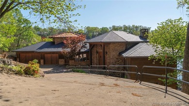 Lodge-style lakefront retreat sitting on over 1 acre with an - photo 2