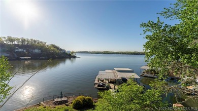 Lodge-style lakefront retreat sitting on over 1 acre with an - photo 5