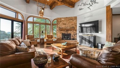 Lodge-style lakefront retreat sitting on over 1 acre with an - photo 9