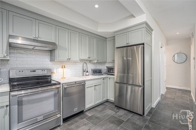 This beautifully renovated c.1852 brick townhome overlooking - photo 46
