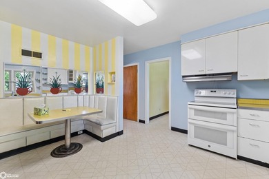 *The Pheasant House on Main* Step into timeless charm with this - photo 11