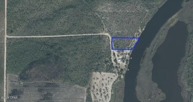 This 2.29 acre waterfront lot sits on a lovely bluff overlooking - photo 4