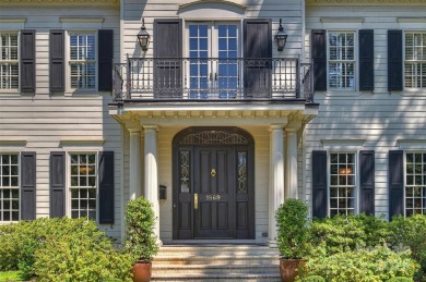 This elegantly renovated 5 bedroom, 5.5 bath home that perfectly