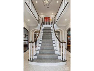 This elegantly renovated 5 bedroom, 5.5 bath home that perfectly