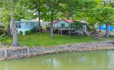 Peaceful lakefront living awaits. Tucked inside a protected - photo 2