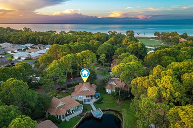 Nestled on the pond in the sought-after Fairways community of