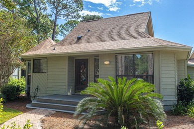 Nestled on the pond in the sought-after Fairways community of