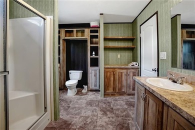 Nearly two acres, a private pond, and a lake town at your back - photo 11