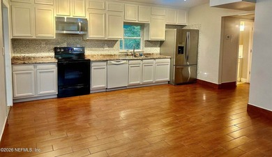 Charming 3BR/1BA concrete block home with major updates and a - photo 2