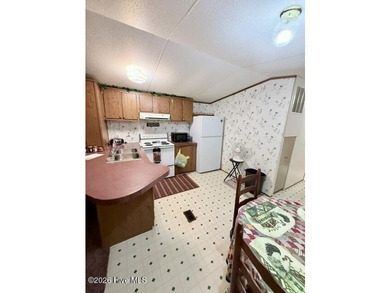 Singlewide home sitting on 1.45 +/- unrestricted acres! Nestled - photo 6