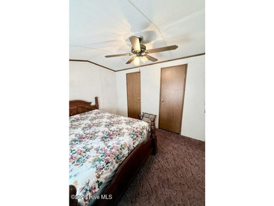 Singlewide home sitting on 1.45 +/- unrestricted acres! Nestled - photo 8