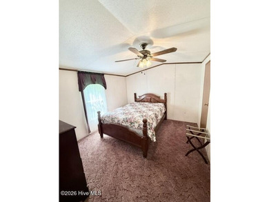 Singlewide home sitting on 1.45 +/- unrestricted acres! Nestled - photo 9