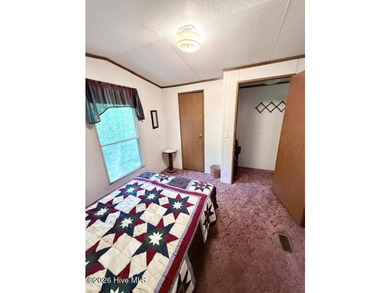 Singlewide home sitting on 1.45 +/- unrestricted acres! Nestled - photo 10