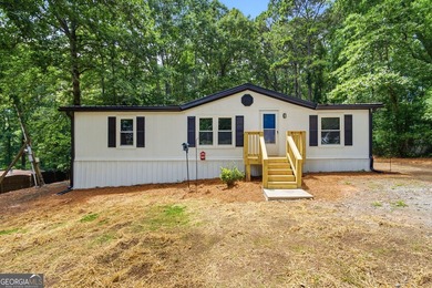 Fully remodeled and move-in ready, this Acworth home offers the - photo 1