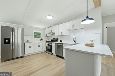 Fully remodeled and move-in ready, this Acworth home offers the - photo 2