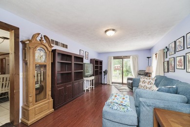 With its knotty pine wood finishes and tree shaded setting, this