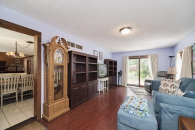 With its knotty pine wood finishes and tree shaded setting, this