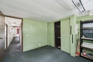 With its knotty pine wood finishes and tree shaded setting, this