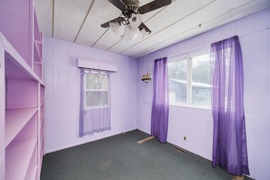 With its knotty pine wood finishes and tree shaded setting, this