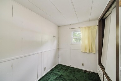 With its knotty pine wood finishes and tree shaded setting, this