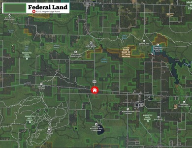 With its knotty pine wood finishes and tree shaded setting, this